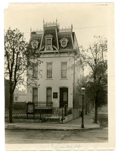Three Story Stone and Brick Residence with Wrought Iron Railing on the Roof and Dormer Windows by William G. Swekosky